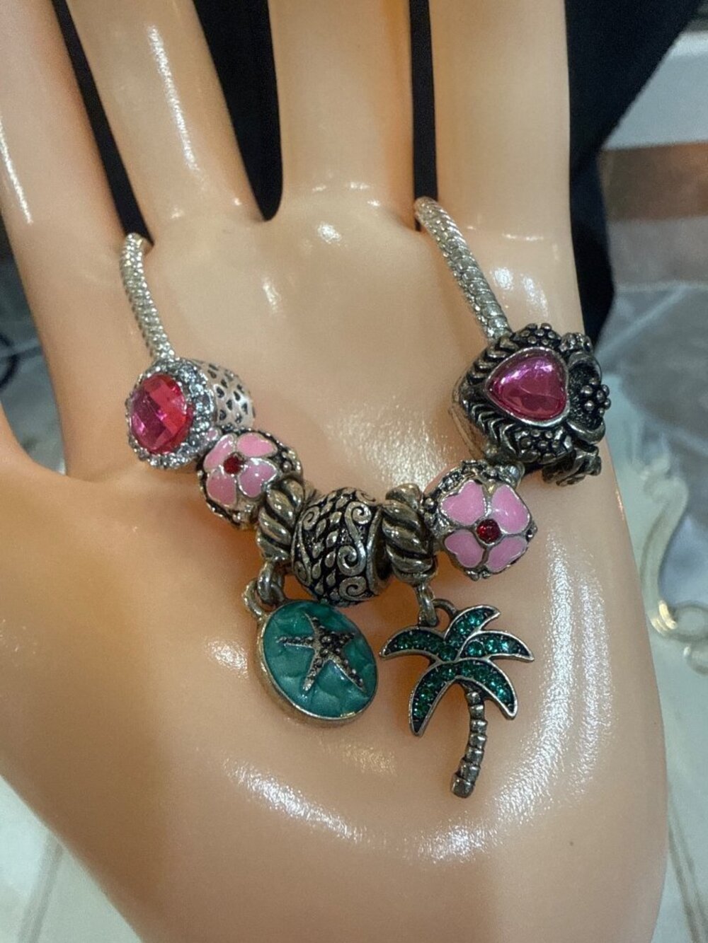 silver snake-chain charm bracelet with beach theme charms